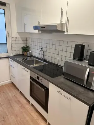 Küche/Küchenzeile in der Unterkunft City Apartment with 2 individual beds and sleeping sofa and kitchen