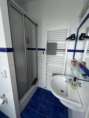Ein Badezimmer in der Unterkunft Hotel Am Vogelsang