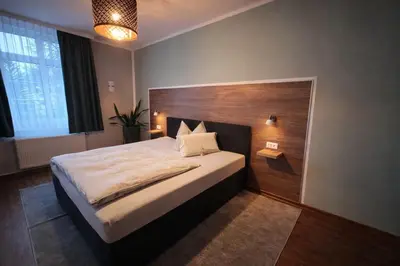 Ein Bett oder Betten in einem Zimmer der Unterkunft Hotel Am Vogelsang