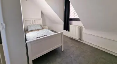 Ein Bett oder Betten in einem Zimmer der Unterkunft BS Oberhausen Comfort Zentral-Apartment