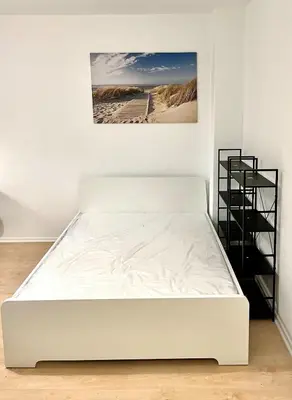 Ein Bett oder Betten in einem Zimmer der Unterkunft Tolles neues Apartment mit Balkon, EBK, Wlan, Smart TV, Netflix