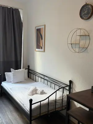 Ein Bett oder Betten in einem Zimmer der Unterkunft Gemütlich und zentral 5 Minuten zum Hauptbahnhof