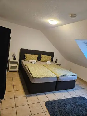 Ein Bett oder Betten in einem Zimmer der Unterkunft homes of ruhr - Monteurwohnung Malocher