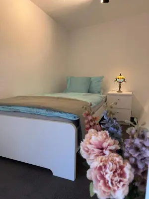 Ein Bett oder Betten in einem Zimmer der Unterkunft Monteurwohnung oder Messewohnung inklusive Fitness Studio