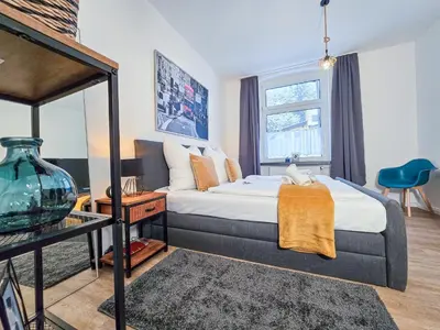 Ein Bett oder Betten in einem Zimmer der Unterkunft Alpha Apartments