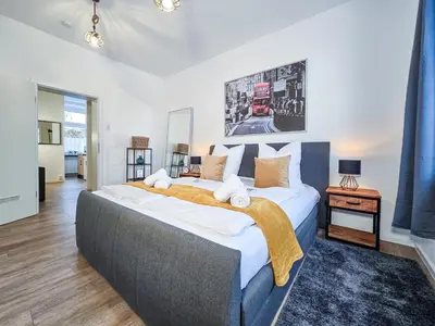 Ein Bett oder Betten in einem Zimmer der Unterkunft Alpha Apartments