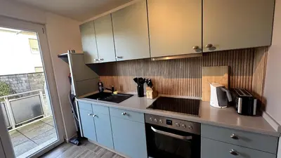 Küche/Küchenzeile in der Unterkunft Cozy Apartment with Balcony I free Parking I WiFi