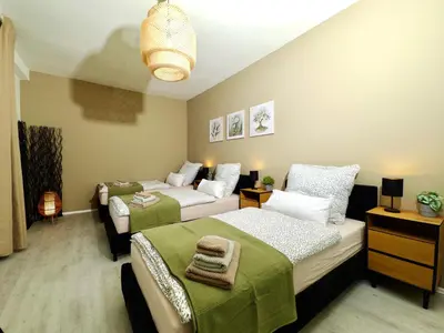 Ein Bett oder Betten in einem Zimmer der Unterkunft Moderne Wohnung mit Balkon ideal für Familien und Geschäftsreisende