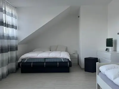 Ein Bett oder Betten in einem Zimmer der Unterkunft Ferienwohnung Niederrhein mit privater Sauna