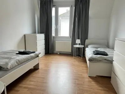 Ein Bett oder Betten in einem Zimmer der Unterkunft FirmenQuartier24 im DG in Wuppertal