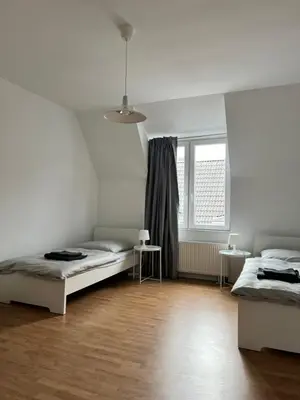 Ein Bett oder Betten in einem Zimmer der Unterkunft FirmenQuartier24 im DG in Wuppertal