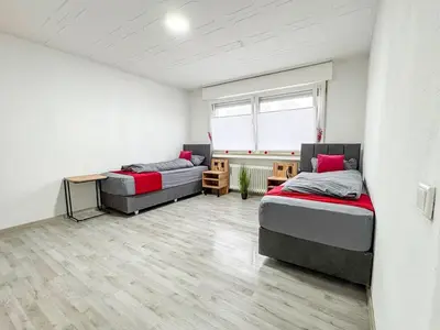 Ein Bett oder Betten in einem Zimmer der Unterkunft Serviceroom24 - Apartment 3 in Gladbeck WLAN - Smart-TV - 24-7 Check-in und Küche