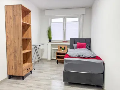 Ein Bett oder Betten in einem Zimmer der Unterkunft Serviceroom24 - Apartment 3 in Gladbeck WLAN - Smart-TV - 24-7 Check-in und Küche