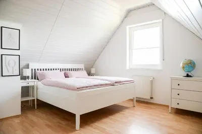 Ein Bett oder Betten in einem Zimmer der Unterkunft Ferienwohnung Rhader Wiesen