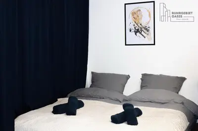 Ein Bett oder Betten in einem Zimmer der Unterkunft Modernes Apartment Zentral mit Küche & Smart TV
