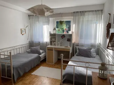 Ein Bett oder Betten in einem Zimmer der Unterkunft Apartment100 qm mit Garten
