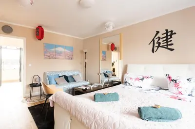 Ein Bett oder Betten in einem Zimmer der Unterkunft - Zen Haven Luxurious 3-Room Japanese-Themed Apartment with King-Size Beds, Balcony, Bamboo Accents, Entertainment Galore & Private Parking - Near Airport & Train Station -