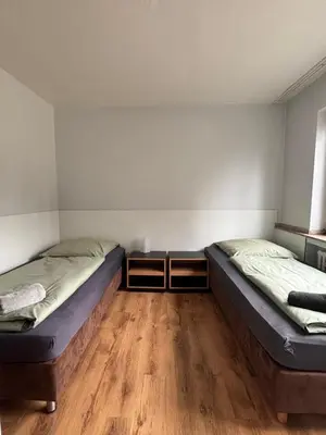 Ein Bett oder Betten in einem Zimmer der Unterkunft Case One Monteur Aparthotel