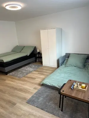 Ein Bett oder Betten in einem Zimmer der Unterkunft Ferienwohnung Ruhr