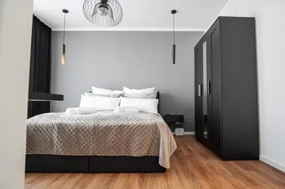 Ein Bett oder Betten in einem Zimmer der Unterkunft EssenFusion Wasserturm - Innenstadt nahe der Messe, SmartTV, Nespresso, Fully Kitchen
