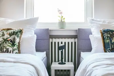 Ein Bett oder Betten in einem Zimmer der Unterkunft EssenFusion Wasserturm - Innenstadt nahe der Messe, SmartTV, Nespresso, Fully Kitchen