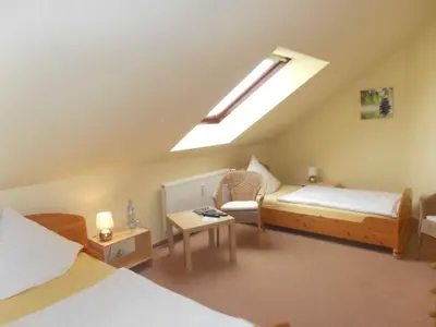 Ein Bett oder Betten in einem Zimmer der Unterkunft Hotel Reesenhof