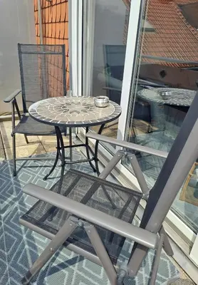 Ein Patio oder anderer Außenbereich in der Unterkunft Ferienwohnug mit Balkon und Carport