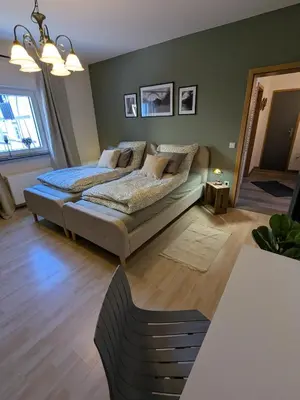 Ein Bett oder Betten in einem Zimmer der Unterkunft Ferienwohnung am Steinweg