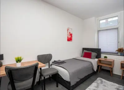 Ein Bett oder Betten in einem Zimmer der Unterkunft Livemore24 - Apartment 1 in Oer-Erkenschwick WLAN