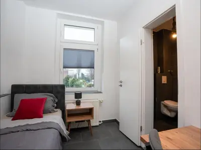Ein Bett oder Betten in einem Zimmer der Unterkunft Livemore24 - Apartment 1 in Oer-Erkenschwick WLAN