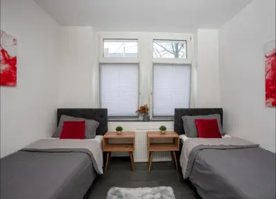 Ein Bett oder Betten in einem Zimmer der Unterkunft Livemore24 - Apartment 1 in Oer-Erkenschwick WLAN