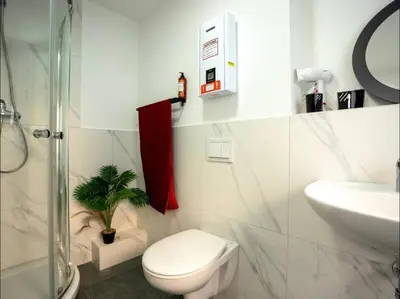 Ein Badezimmer in der Unterkunft Livemore24 - Apartment 4 in Herten West 24-7 Check-in