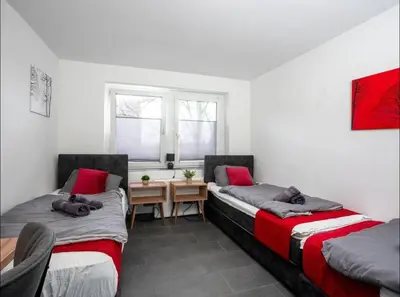 Ein Bett oder Betten in einem Zimmer der Unterkunft Livemore24 - Apartment 2 in Oer-Erkenschwick WLAN