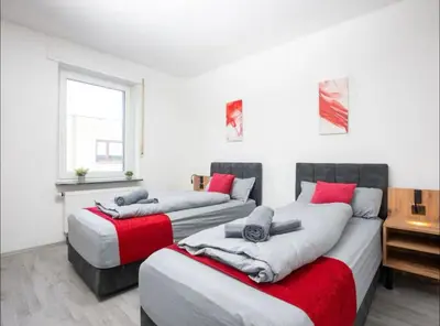Ein Bett oder Betten in einem Zimmer der Unterkunft Livemore24 - Space in Herten West 24-7 Check-in