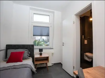 Ein Bett oder Betten in einem Zimmer der Unterkunft Livemore24 - Space in Oer-Erkenschwick WLAN