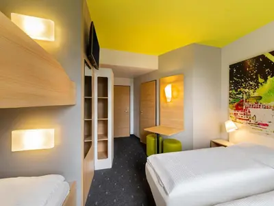 Ein Bett oder Betten in einem Zimmer der Unterkunft B&B Hotel Mülheim an der Ruhr
