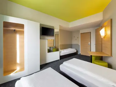 Ein Bett oder Betten in einem Zimmer der Unterkunft B&B Hotel Mülheim an der Ruhr