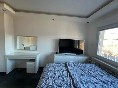 Ein Bett oder Betten in einem Zimmer der Unterkunft Modernes zentrales Appartement