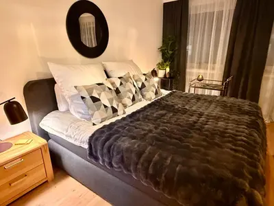 Ein Bett oder Betten in einem Zimmer der Unterkunft Schwebebahn View Apartment