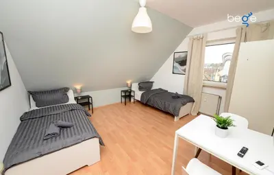 Ein Bett oder Betten in einem Zimmer der Unterkunft BEGE APARTMENTS WorkNest Comfort
