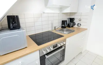 Küche/Küchenzeile in der Unterkunft BEGE APARTMENTS WorkNest Comfort