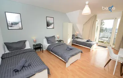 Ein Bett oder Betten in einem Zimmer der Unterkunft BEGE APARTMENTS WorkNest Comfort