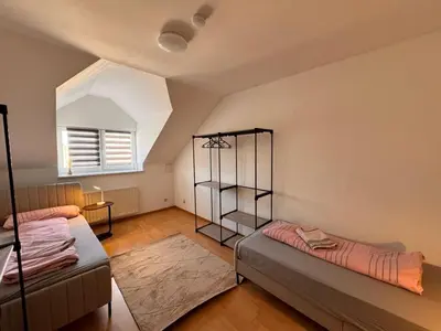 Ein Bett oder Betten in einem Zimmer der Unterkunft A&V Apartments Rosa in Iserlohn Kluse 21