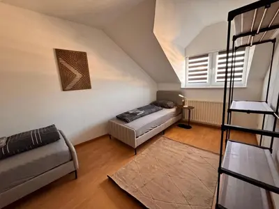 Ein Bett oder Betten in einem Zimmer der Unterkunft A&V Apartments Rosa in Iserlohn Kluse 21