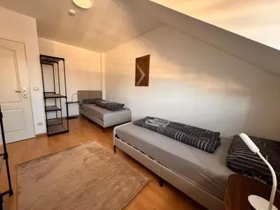 Ein Bett oder Betten in einem Zimmer der Unterkunft A&V Apartments Rosa in Iserlohn Kluse 21