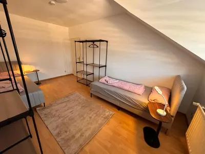 Ein Bett oder Betten in einem Zimmer der Unterkunft A&V Apartments Rosa in Iserlohn Kluse 21