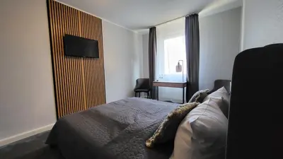 Ein Bett oder Betten in einem Zimmer der Unterkunft N Hotel