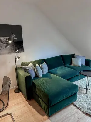Ein Sitzbereich in der Unterkunft Fancy Apartment with 4K TV for 3 people and 2 people sleep couch - includes kitchen