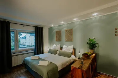 Ein Bett oder Betten in einem Zimmer der Unterkunft Atlas Apartment Essen, 3 Zimmer, Uniklinik, Messe, Parkplatz, Balkon