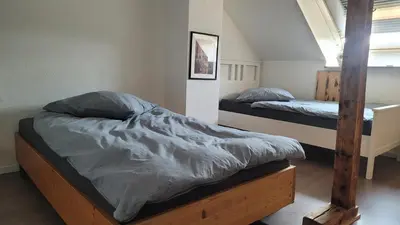 Ein Bett oder Betten in einem Zimmer der Unterkunft TinyWohnung im Pott